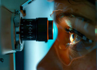Close-up of an eye examination with a slit lamp
